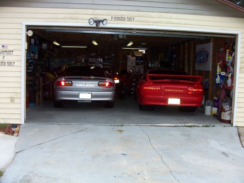New Z/28 Having A Chat With BIG RED, BIG RED No Like New Member Of The Camaro Family, ( Alarm Go's Off for NO Reason ) RED Just Got Over Having White Around And Now Is Really Pissed !!!