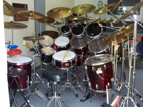 Eight Toms, D-W Double Bass Pedal, 18 Cymbals, Three Roto Toms, And Effects. 
